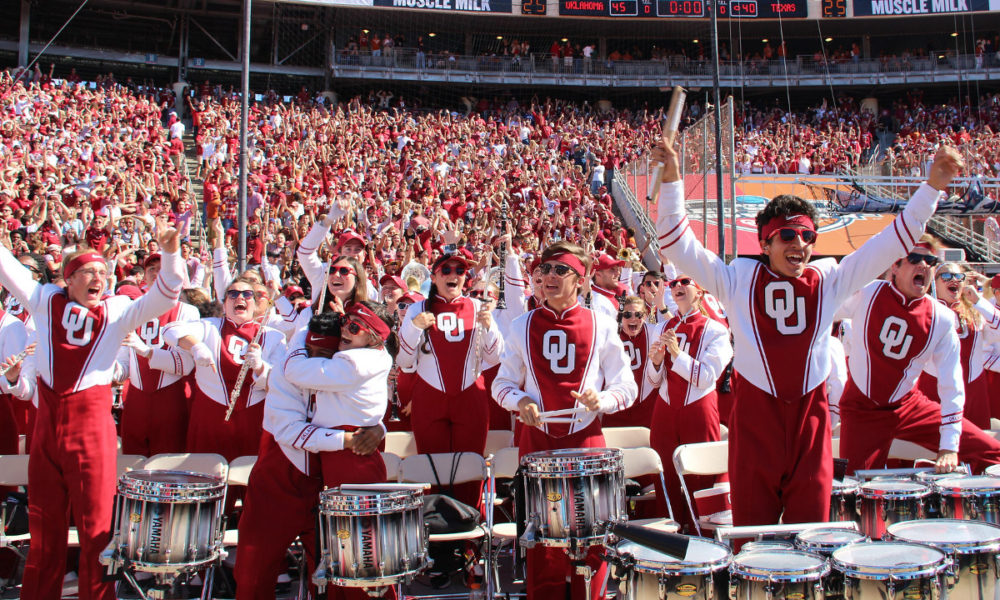 The Pride of Oklahoma drumline celebrating a touchdown.