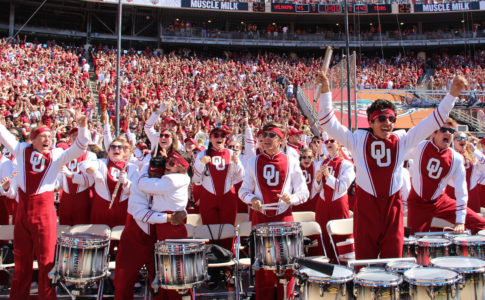 The Pride of Oklahoma drumline celebrating a touchdown.