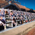 A photo of cardboard cutouts of members of the spirit of Marching Illini.